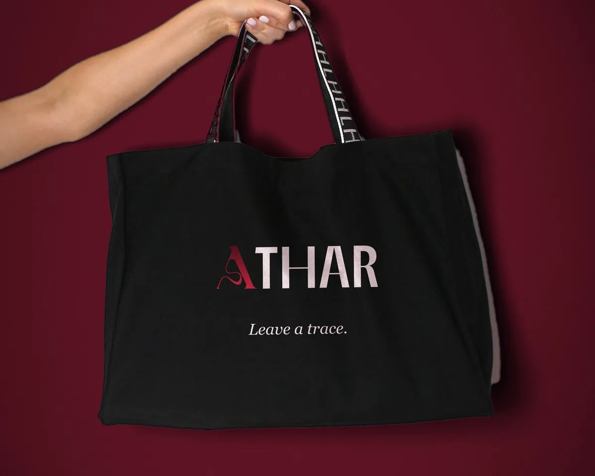 Athar wordmark printed on a black tote bag