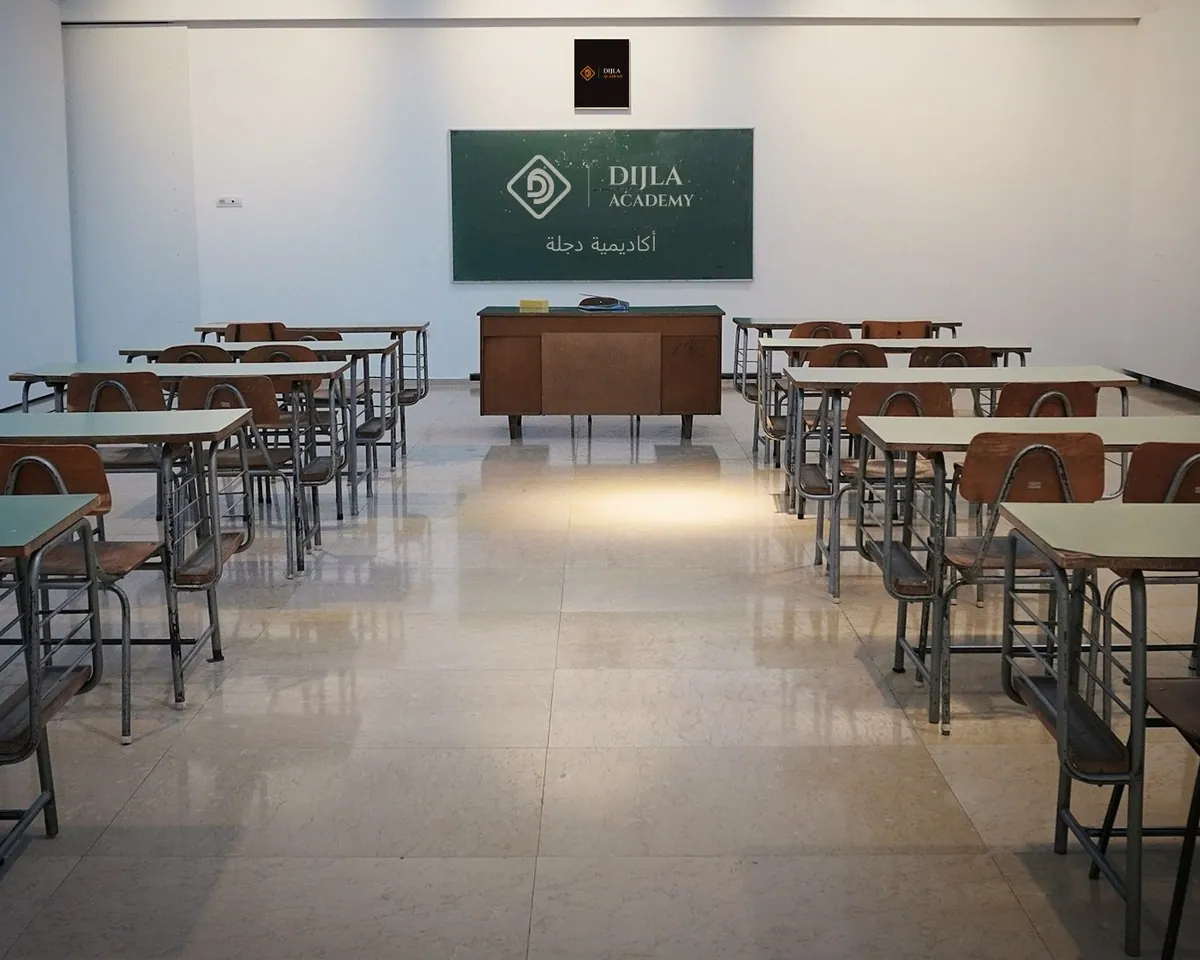 Dijla Academy chalked on a classroom board