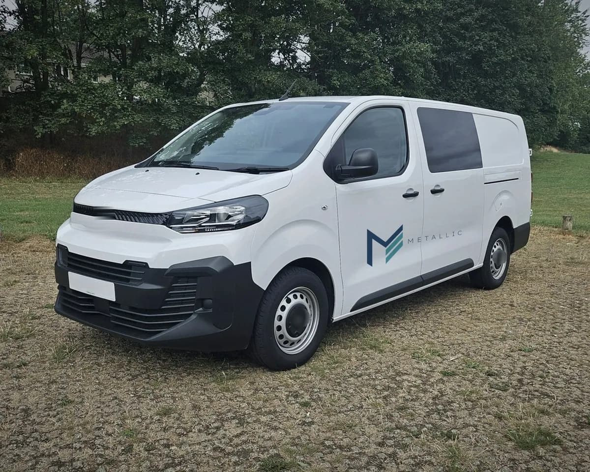 Metallic livery on the side of a white van