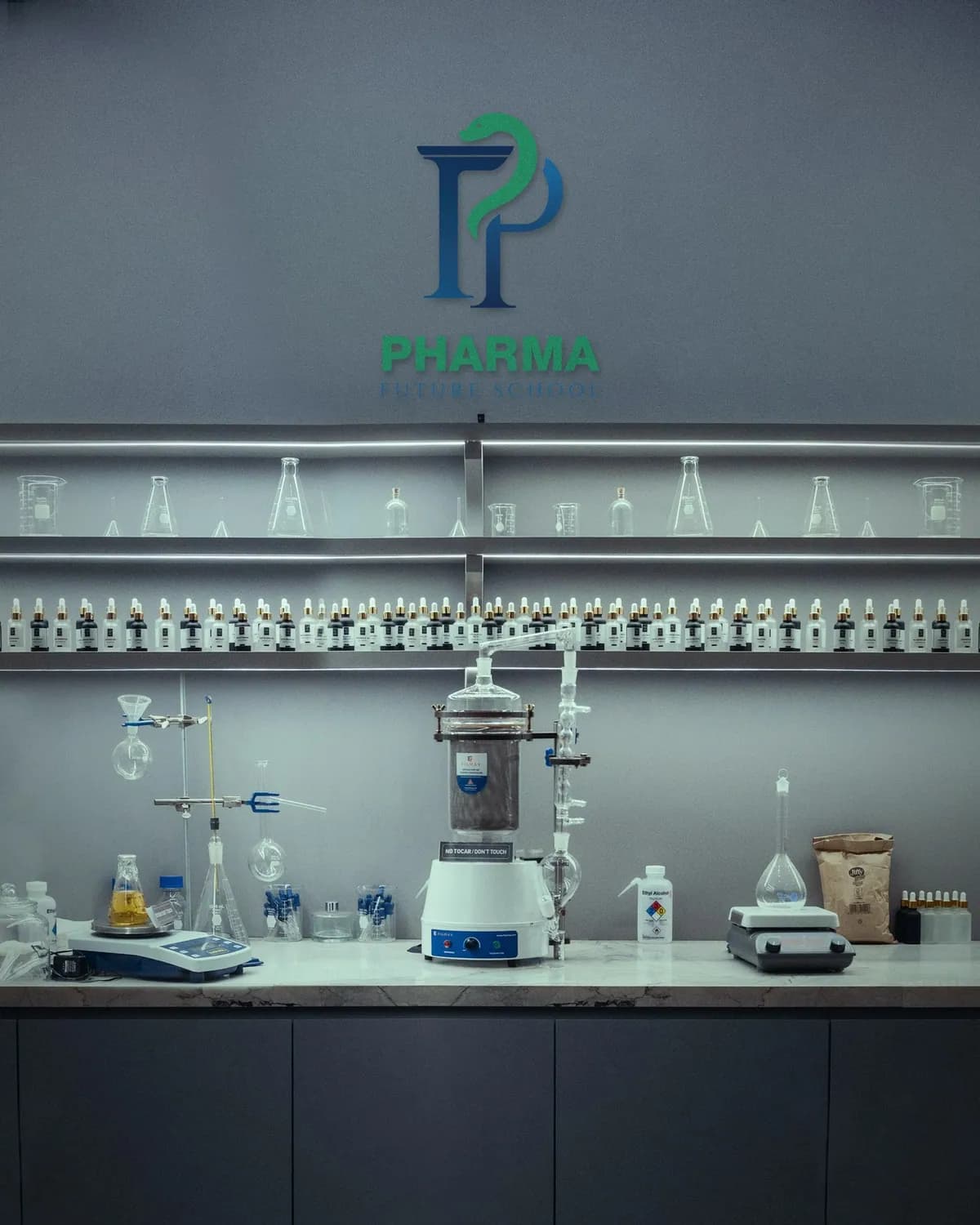 Pharma Future School sign on a laboratory wall