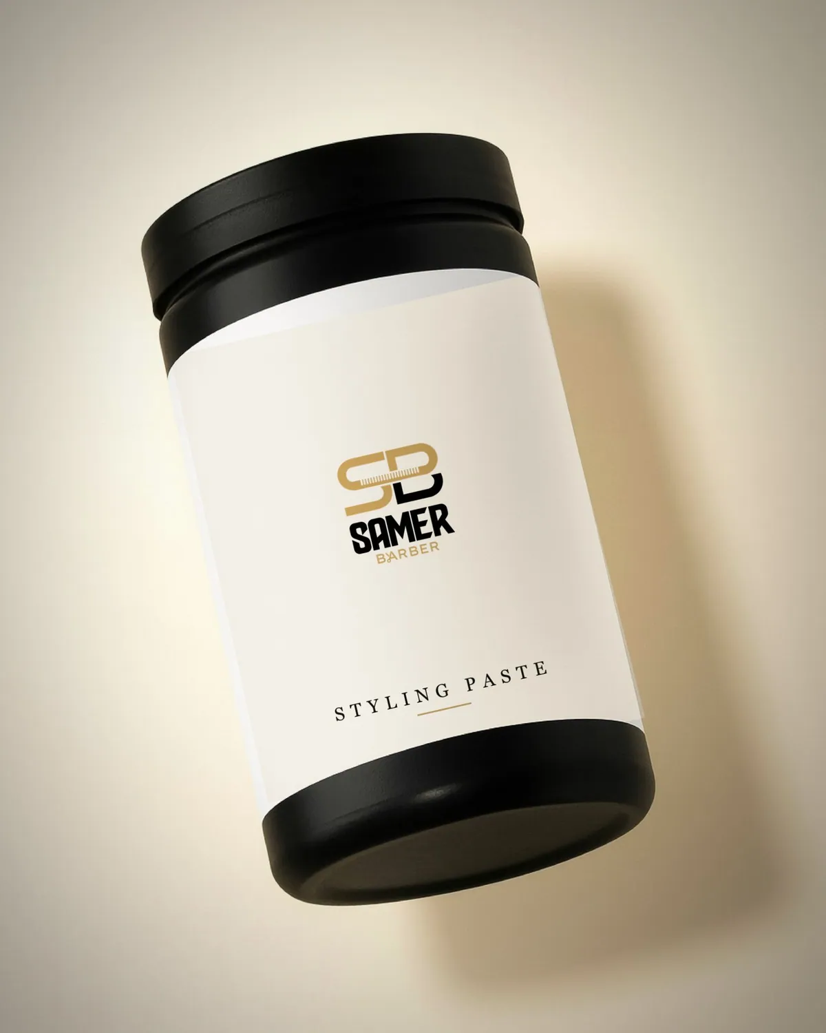 Samer Barber styling paste tub with a chalk label