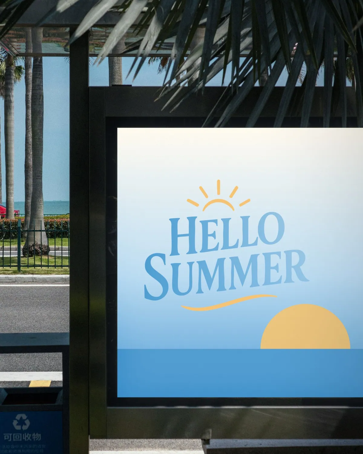 Hello Summer poster in a bus shelter under palm leaves