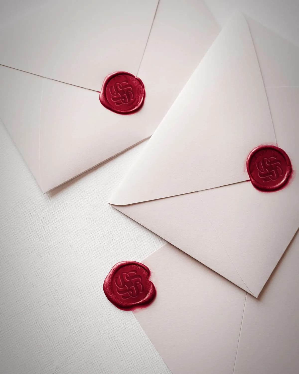 Envelopes sealed with crimson wax pressed with the Tales rosette